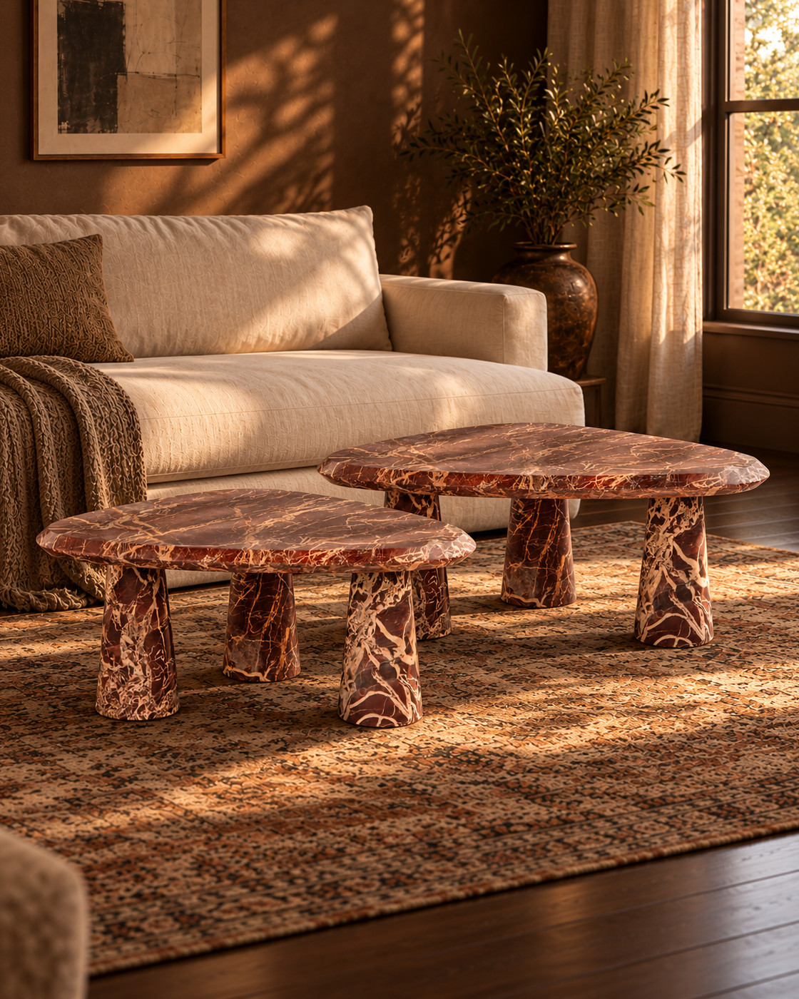 Rosso Small and Large marble coffee tables styled together in a living room; each sold separately