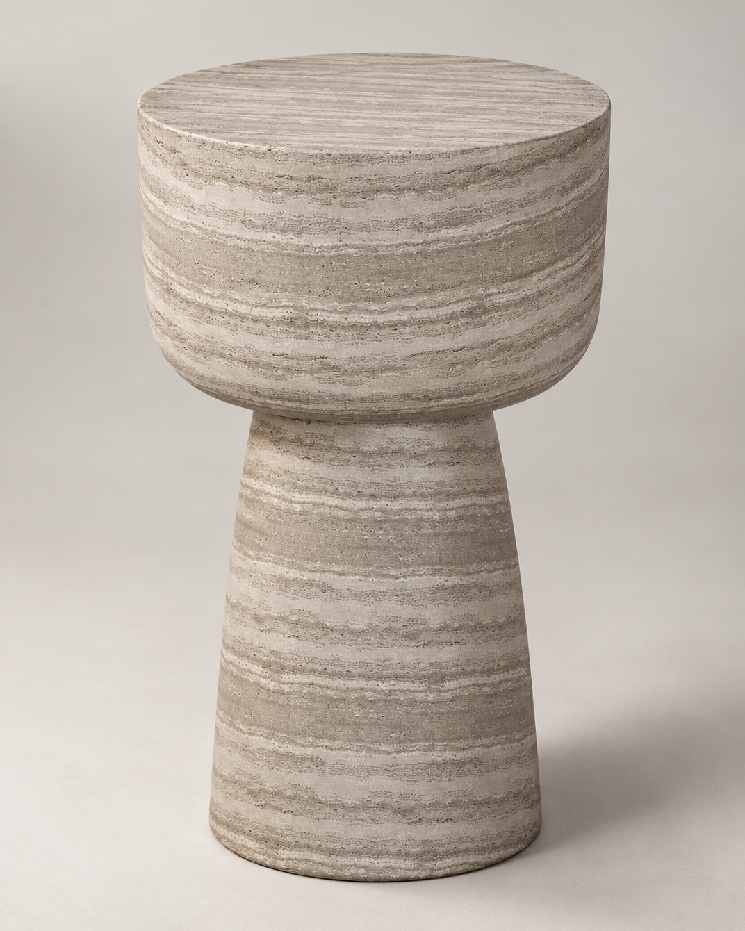 Angled view of the Maro concrete pedestal side table