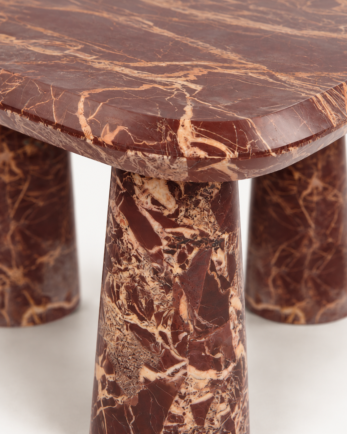 Rosso tabletop edge and leg with cream and gold-toned veining