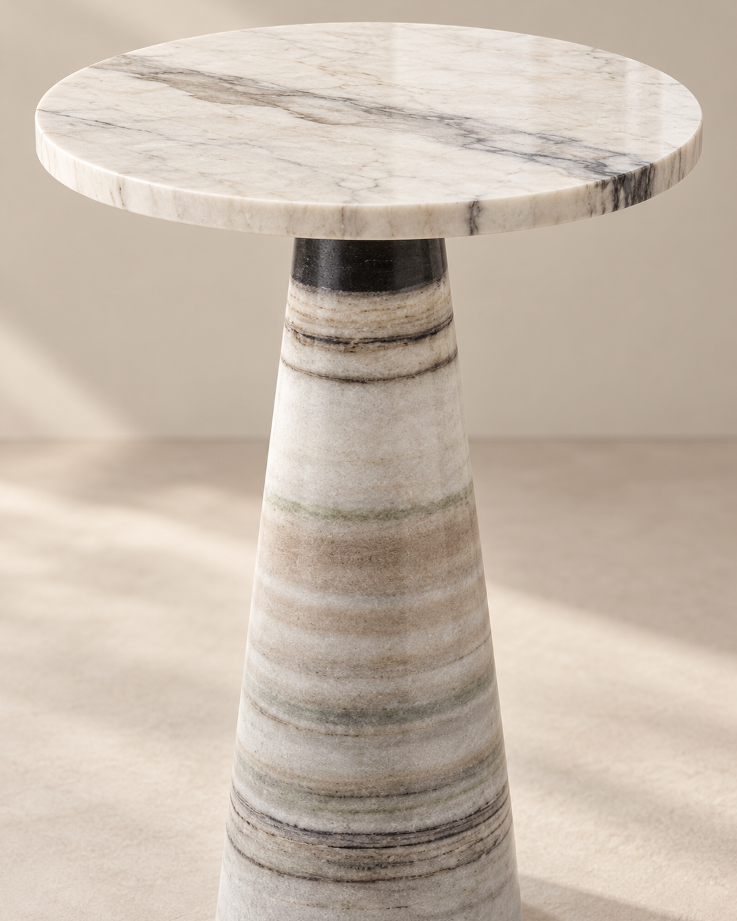 Natural dark veining and round marble edge of the Vellora side table
