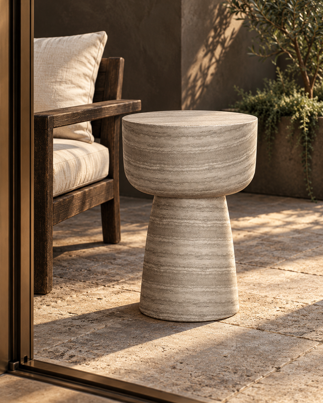 Maro concrete outdoor side table on a shaded terrace