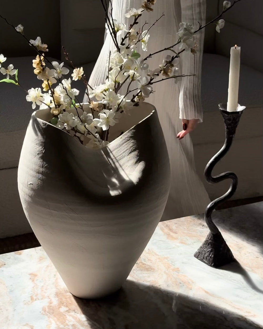 White ceramic Delamo vase from Belaré Home's Elevated Collection, featuring a sleek, modern design.