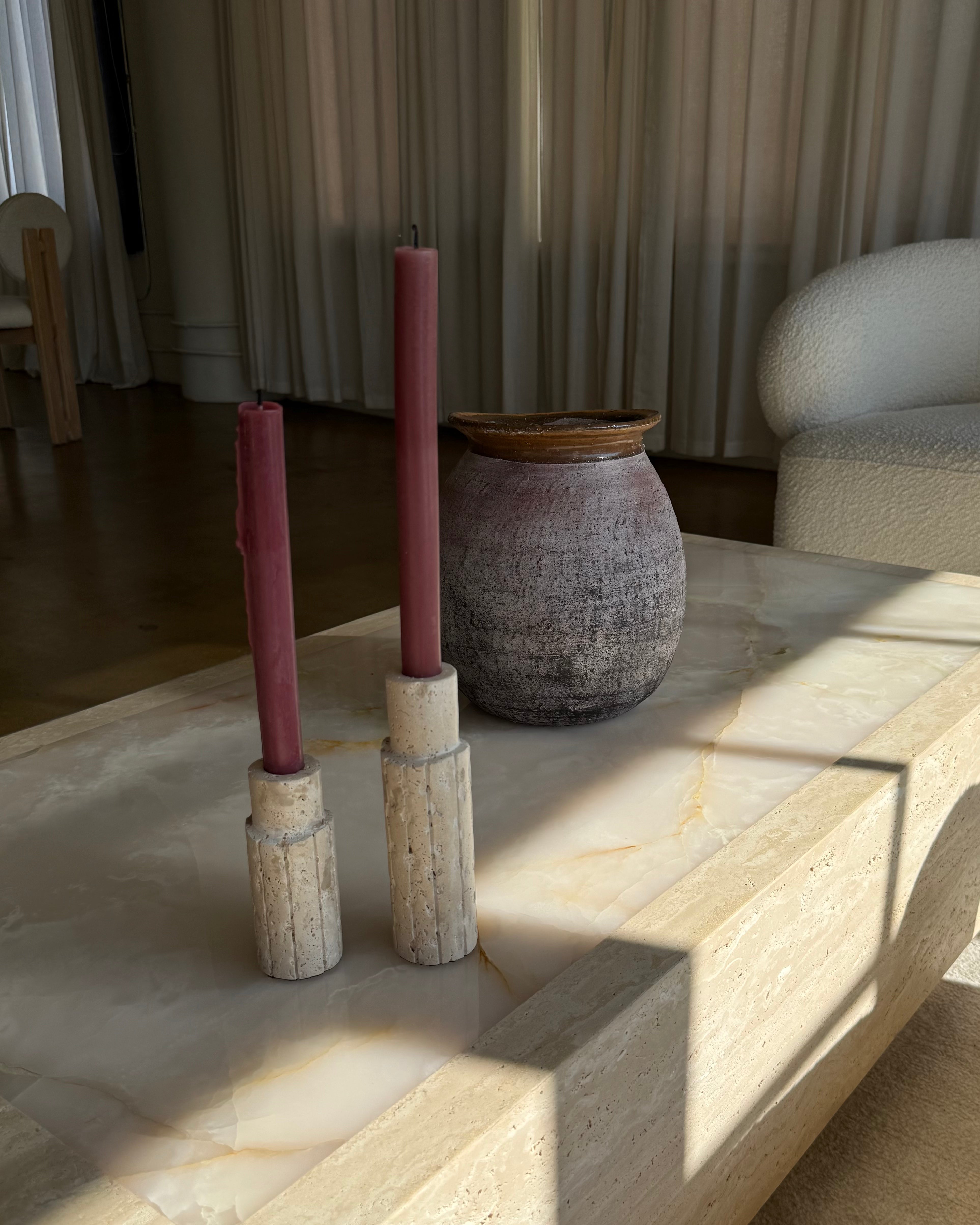 Close-up of a Travertine Candle Holder, showcasing its unique porous texture and natural variations.