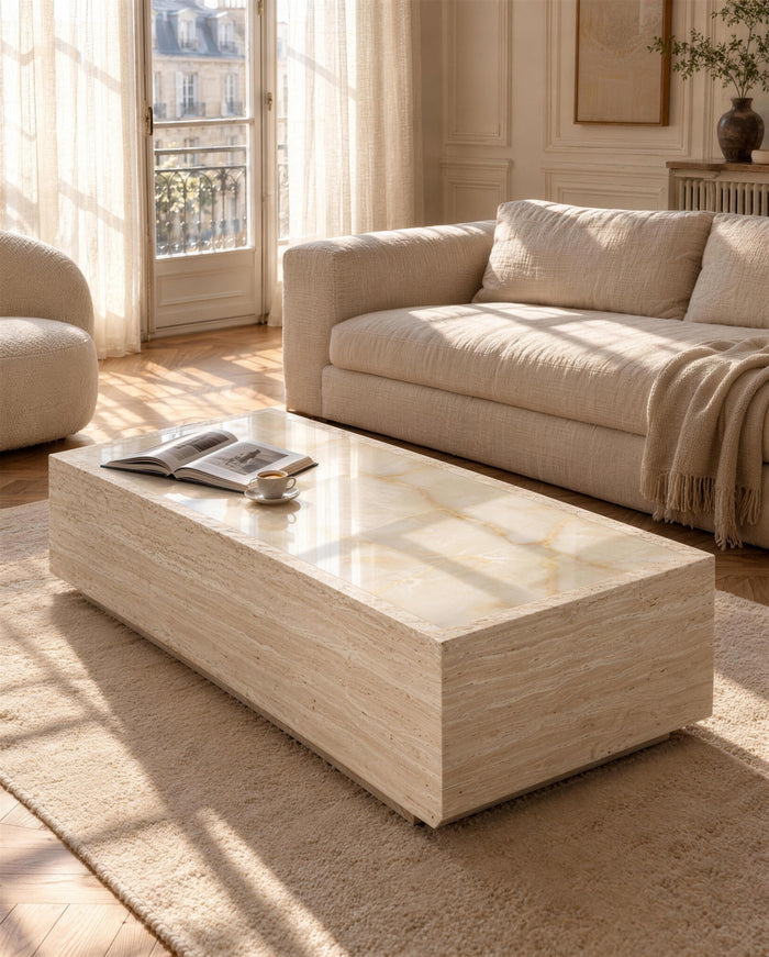 Palermo travertine and onyx coffee table in a sunlit Paris salon beside a boucle sofa